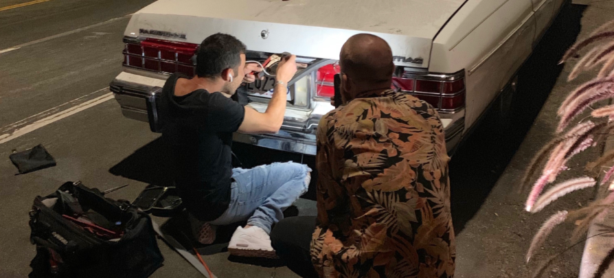 A West Coast Locksmith tech helps unlock a customer's trunk late at night.