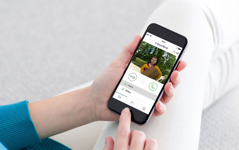 A person uses a phone app to access their lock.